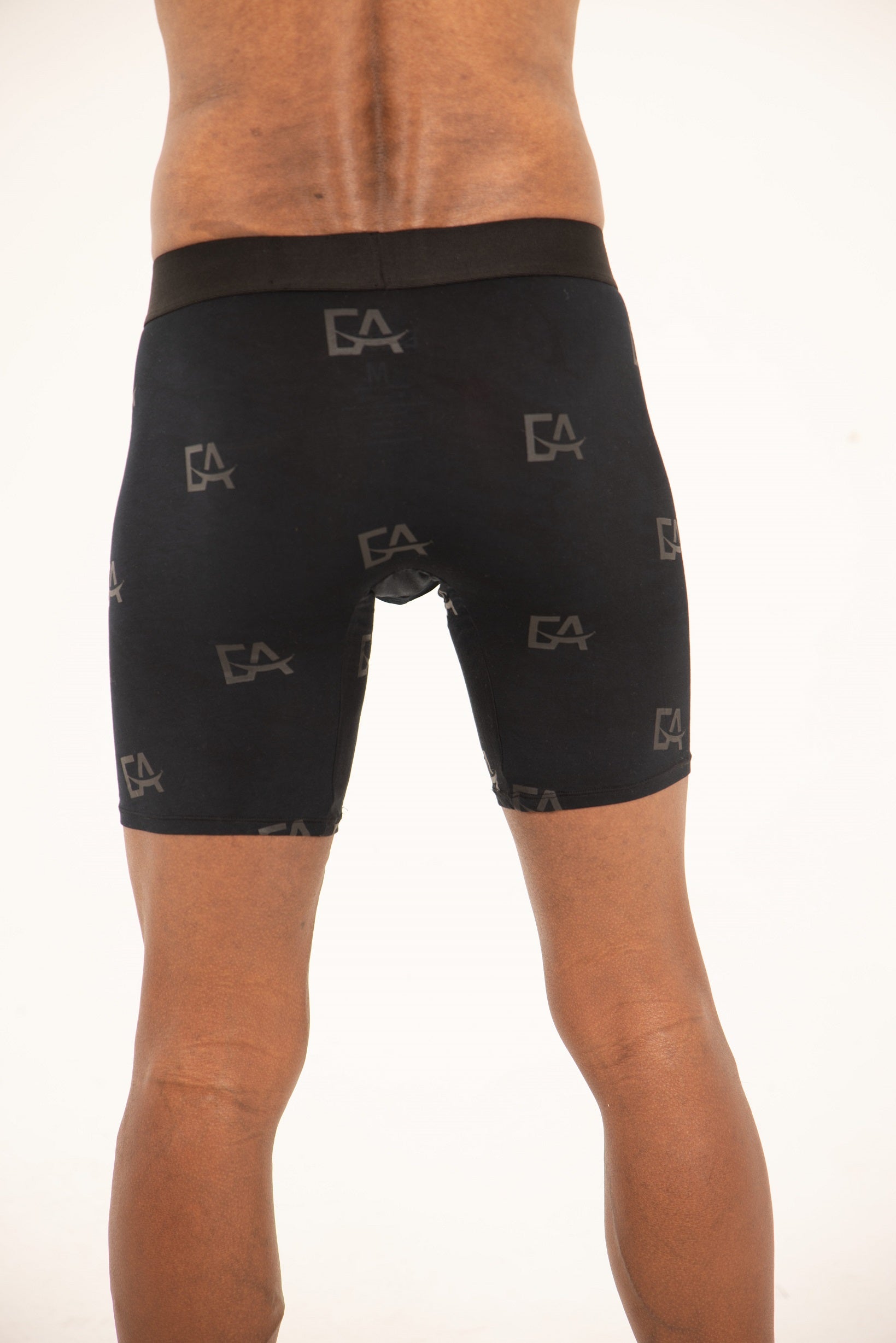 Black compression shorts with brand logo on a white background